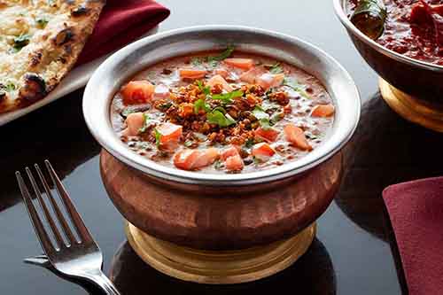 Indian Food East Hanover Morris County 9. Dal Makhani

An amazing black lentil and tomato concoction that will leave you satisfied even without the naan. But who would want to do that? Dal Makhani is a popular dish from the Punjab region of the Indian subcontinent. The primary ingredients are whole black lentil, red kidney beans, butter & cream which gives this entrée it's richness. 